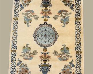 Ivory decorative rug featuring a delicate central medallion, floral accents, ornamental motifs, and elegant scrolling details.