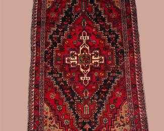 Vibrant red, black, and ivory traditional rug featuring a bold diamond-shaped central medallion and intricate geometric detailing.