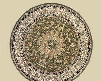 Round green and ivory rug featuring an ornate floral medallion with intricate botanical detailing and a patterned outer border.