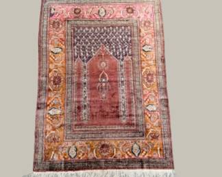 Warm rust and terracotta traditional rug with an ornate central medallion.