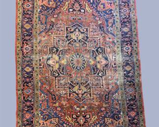 Soft blue, rust, ivory, and muted orange traditional rug featuring an intricate all-over floral pattern.