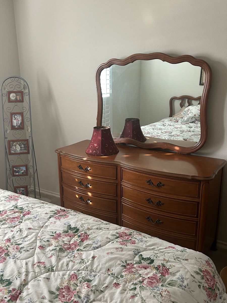 Classic, vintage dresser with mirror. Red lampshade. 