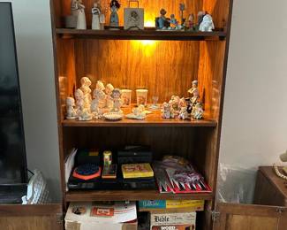 Wall unit with light. DVD player and classic board games. Precious Moments. 
