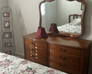 Classic, vintage dresser with mirror. Red lampshade. 