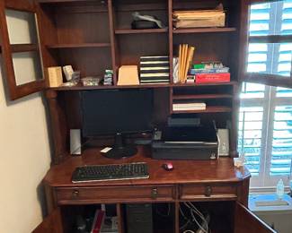 Work station. Office desk. Display case. Printer. 