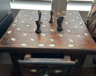 Turkish chess board with brass pieces in a drawer
