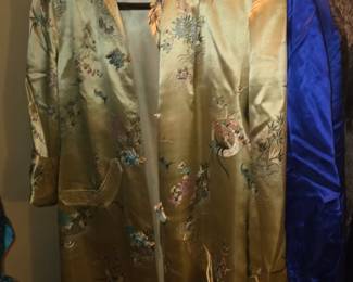 vintage gold silk brocade or satin Chinese-style duster robe or coat featuring an intricate floral and avian pattern (such as peonies and cranes).