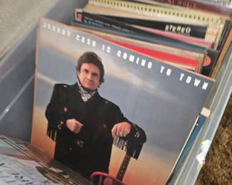 This image shows the 1987 vinyl LP Johnny Cash Is Coming to Town by Johnny Cash, released on Mercury Records.