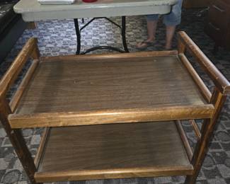 vintage 2-tier wooden serving cart or tea trolley, often styled in the mid-century modern aesthetic.