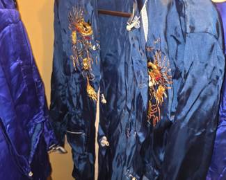 vintage blue silk or satin pajama jacket and lounge set featuring hand-embroidered gold dragon motifs, commonly dating from the mid-20th century (1940s–1950s).