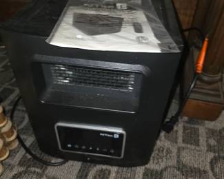 NTec KUH25-01 (or similar NTec model) 1500W infrared compact electric space heater with a digital LED control panel and remote control.