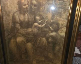 image is a reproduction of The Virgin and Child with Saint Anne and Saint John the Baptist (commonly known as the Burlington House Cartoon), a famous charcoal and chalk drawing by Leonardo da Vinci.
