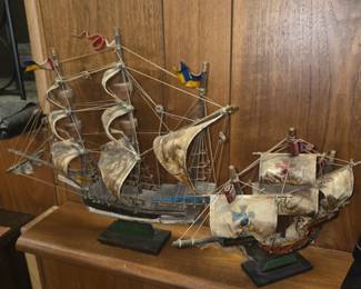 mid-century decorative model sailing ships—commonly styled as replicas of historical vessels like the Mayflower or Santa María—crafted with wooden hulls and fabric or canvas sails on black bases
