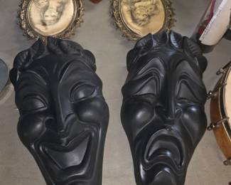 vintage comedy and tragedy theatrical wall masks, commonly made of black-painted chalkware, plaster, or ceramic, representing the classical Greek muses Thalia and Melpomene