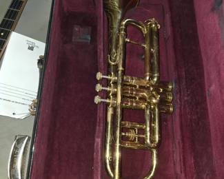 to be a vintage brass instrument, likely a C.G. Conn Pan American cornet or trumpet from the 1940s–1950s (such as a Pan American or Conn 80-A style model) resting in a hardshell case with a velvet interior