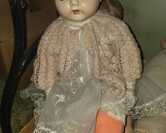 vintage composition-head baby doll with a cloth body, likely dating from the 1920s to 1940s (similar to styles made by manufacturers like Effanbee or Horsman