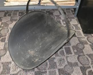 firewood log holder and carrier basket with an arched top handle (often referred to as a fireside log cradle or scuttle)