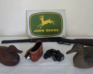 BB gun , duck decoys binoculars and John Deere sign