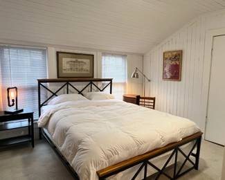 Beautiful, sturdy mixed-material Queen size bed frame in excellent condition.This is the popular Hillsdale Ashford platform bed, featuring a striking blend of industrial black metal and warm oak-finished wood top rails. It has a gorgeous geometric "X" design on both the headboard and footboard that fits perfectly with Modern Farmhouse, Industrial, or Mid-Century decor.Material: Textured black steel frame with solid wood accent top rails.Support: Strong metal slats (no bulky box spring required, though you can use one if you prefer a higher profile).Condition: Excellent secondhand condition. Clean, stable, and completely solid with no squeaks.Style: Modern Farmhouse / Industrial / Transitional.Mattress, bedding, and nightstand included.