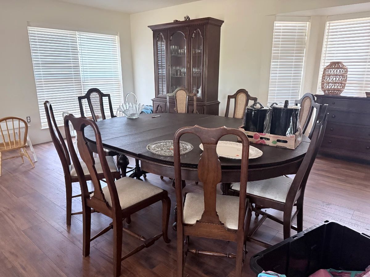 Antique dining chair and 4 matching cane-backed chairs and 4 additional chairs. Table includes 4 leaves (seats 12)