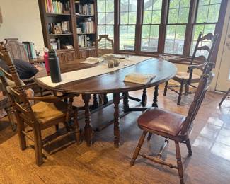 Round gateleg table that seats 6. There are 6 chairs (in another photo).