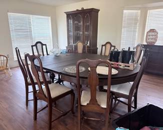 Antique dining chair and 4 matching cane-backed chairs and 4 additional chairs. Table includes 4 leaves (seats 12)