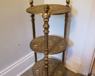 Cast metal plant stand with gold painted finish