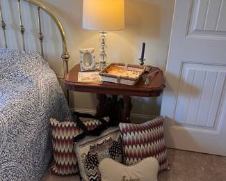Throw pillows, nightstand, lamp