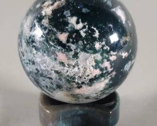 Lot 466  Polished sage agate sphere with a moss agate stand