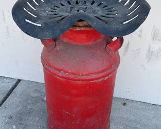 Lot 145  Rustic milk can tractor stool
