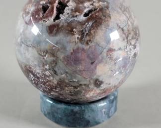 Lot 465  Polished chalcedony agate crystal sphere with a