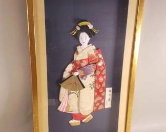 Lot 334  Framed Japanese fabric art geisha holding a