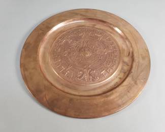 Lot 565  Copper embossed Aztec sun calendar