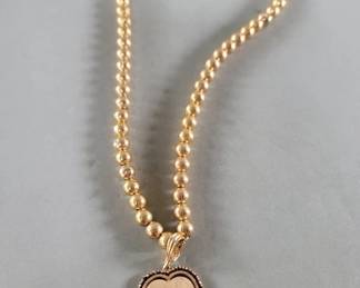 007  Lot 273  14k gold beaded necklace with 14k gold and ruby