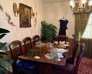 Dining room table with chairs. Prints.