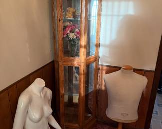 Curio cabinet. Mannequins