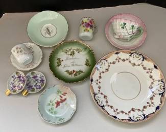 Assortment of Porcelain Teacups Saucers Spoon Rests and Plates