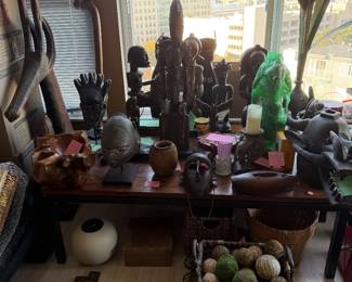 Amazing collection of fine African art and sculpture, miscellaneous decorator items, baskets, antique rugs, Burled wood vessels, brush pots, etc!