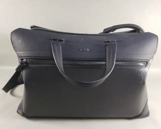 Lot 389  Tumi carry on bag with dust cover