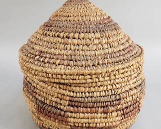Lot 554  Vintage handmade coiled lidded basket