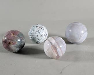 Lot 415  Four polished agate and jasper spheres