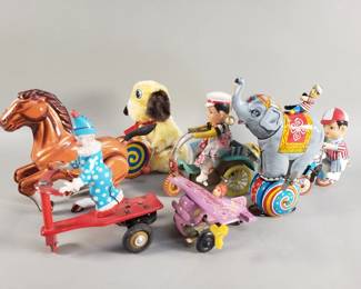 Lot 312  Vintage tin wind up toys