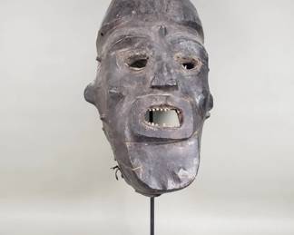 121  Lot 50  Vibtage African wood and leather bound helmet mask