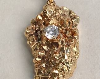 Lot 487  Goldplated nugget and diamond pendant