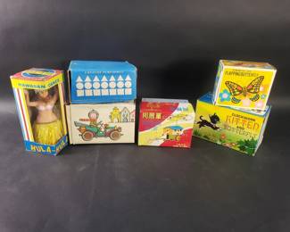 Lot 306  Vintage wind up toys