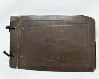 Lot 165  Antique journal with photographs