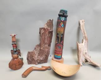 Lot 525  Group of carved wood totem poles, petrified w
