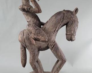 Lot 118  Antique hand carved wood equestrian sculpture