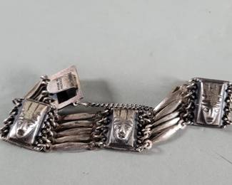 Lot 409  Vintage Mexican silver panel bracelet depicting