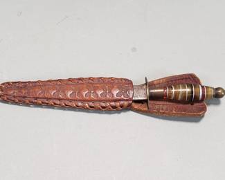 Lot 317  Vintage letter opener, handtooled leather sheath